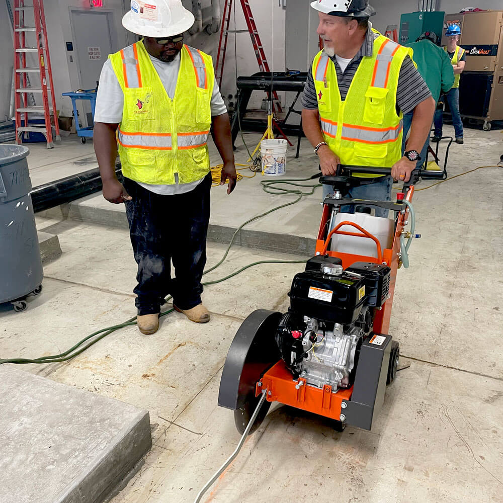 Photo of Cardinal contractors holding a core drilling